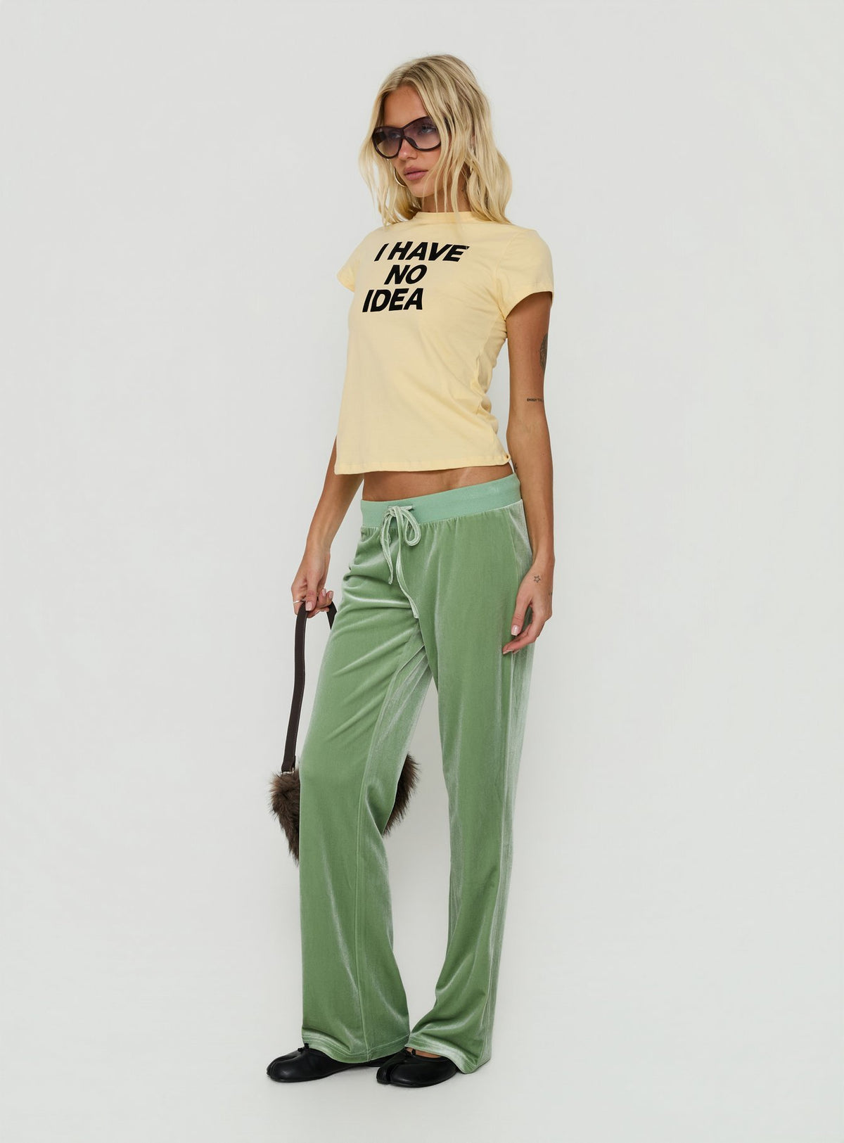 Crafted from Alba Track Pant Sage womens-regular-pants with mid-rise side view of model wearing Princess Polly