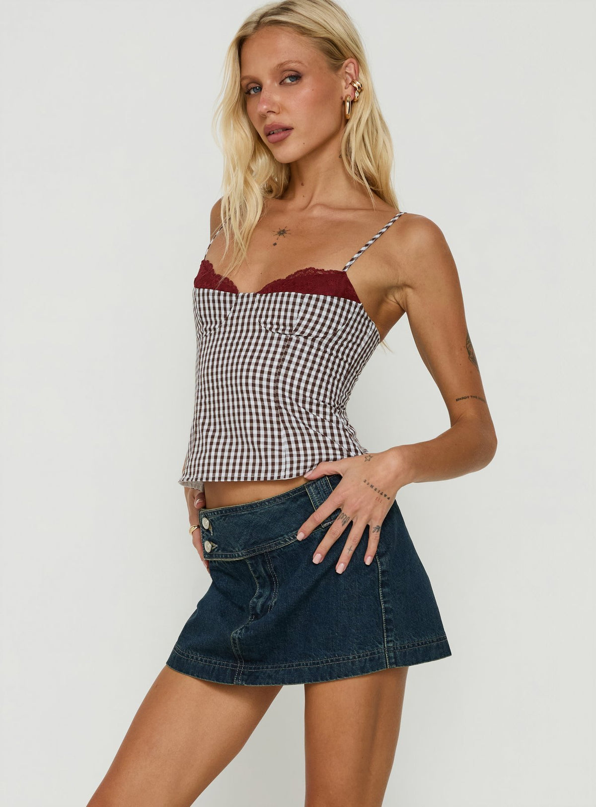 Designed with a-line shape, the Ladena Mid Rise Double Button Mini Skirt Raw Denim womens-skirts features frayed hem Princess Polly