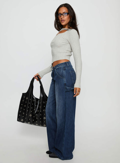 side view of model wearing Princess Polly Downtowner Low Rise Cargo Jeans Mid Blue Wash Low Rise Jeans Jeans 