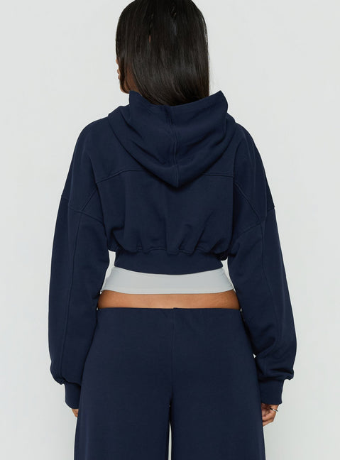 Designed with a hood, the Lanna Fleece Zip Through Cropped Hoodie Navy womens-jumpers in short length back view of model wearing Princess Polly