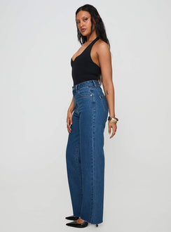 side view of model wearing Princess Polly Kalinda High Rise Straight Leg Jeans Mid Blue High Rise Jeans Jeans 