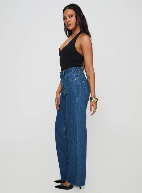 side view of model wearing Princess Polly Kalinda High Rise Straight Leg Jeans Mid Blue High Rise Jeans Jeans 