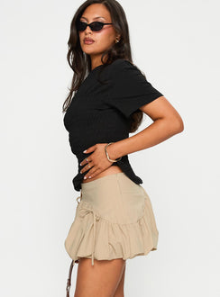   side view of model wearing Princess Polly Palloma Bubble Hem Mini Skirt Beige Mini Skirts Skirts 