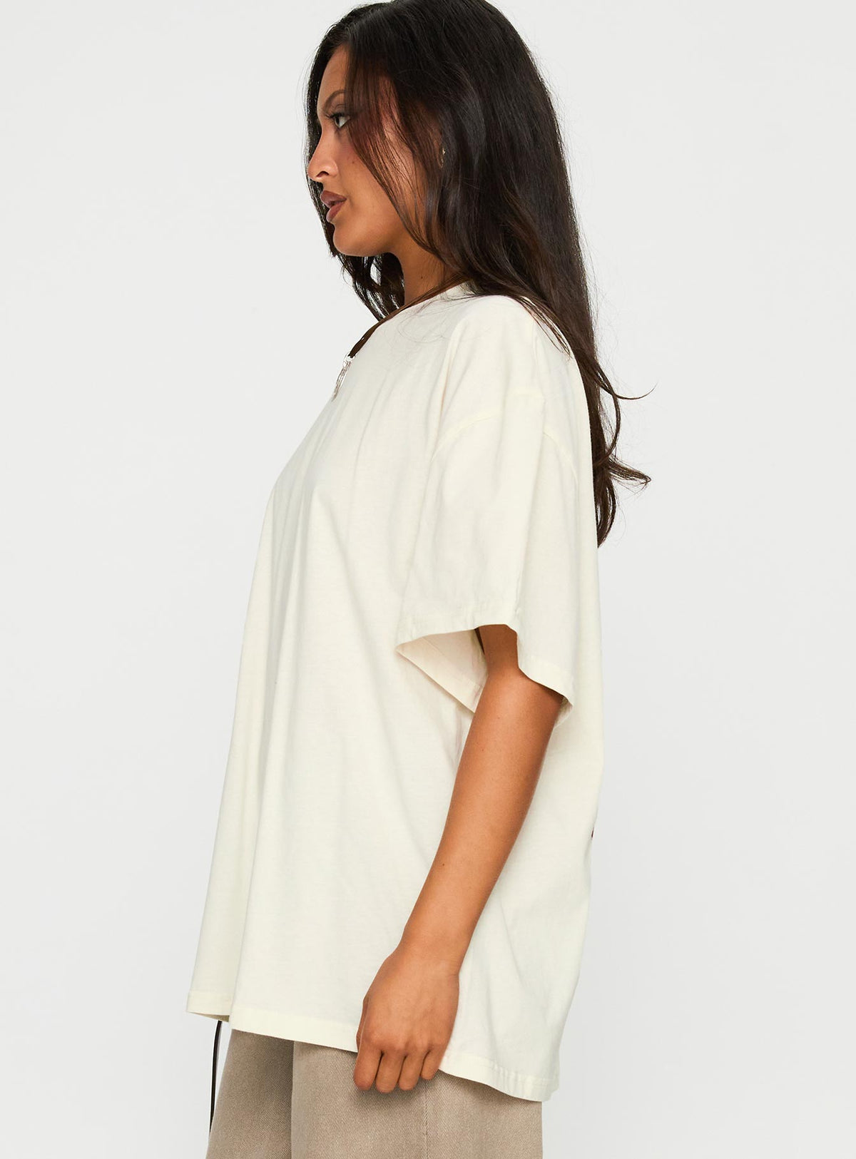 side view of model wearing Princess Polly What's In My Bag Graphic Top Cream / Multi Half Sleeves Crew Neck 