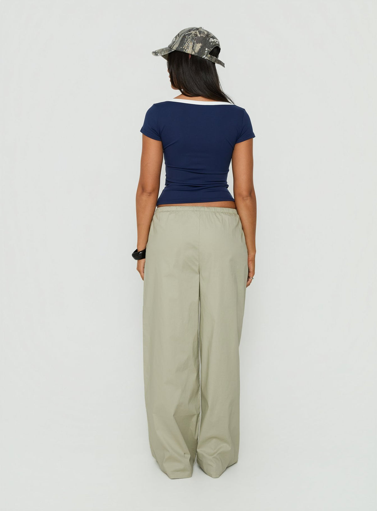 Explore the Toren Drawstring Straight Leg Pants Stone womens-regular-pants with mid-rise back view of model wearing Princess Polly