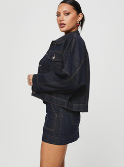   side view of model wearing Princess Polly Hughes Mini Skirt Dark Wash Denim Petite Mini Skirts Skirts 