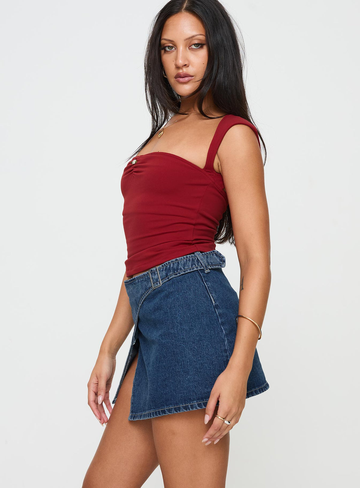   side view of model wearing Princess Polly Wait Up Denim Wrap Mini Skirt Mid Wash Mini Skirts Skirts 