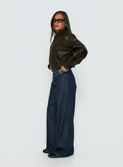side view of model wearing Princess Polly Paltrow Mid Rise Wide Leg Cargo Jeans Dark Blue Wash Mid Rise Jeans Jeans 