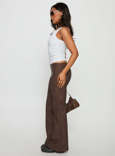 side view of model wearing Princess Polly Trickrider Tie Side Faux Leather Pants Chocolate Mid Rise Pants Pants 