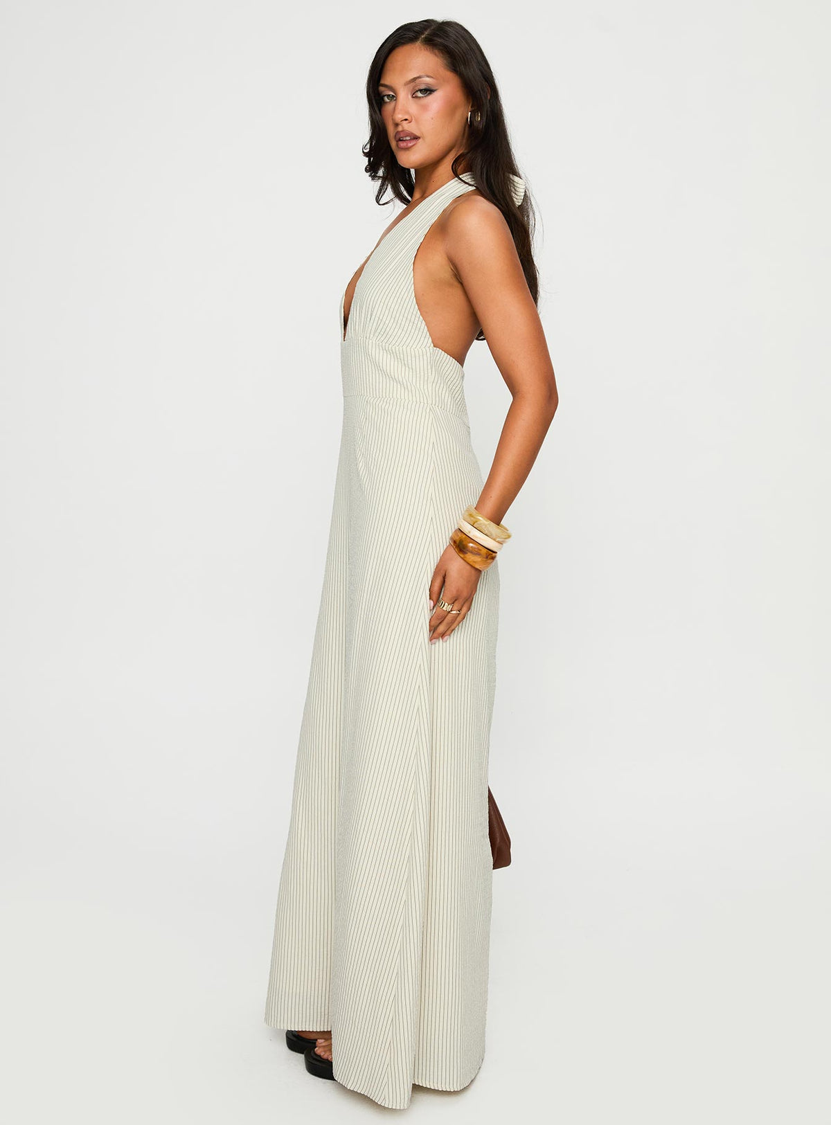 side view of model wearing Princess Polly Caralyn Halter Maxi Dress Multi Stripe Plunger 