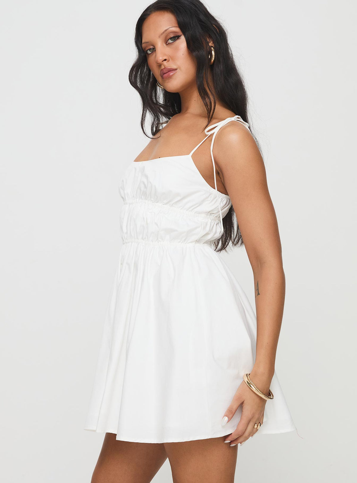 side view of model wearing Princess Polly Jacksonne Mini Dress White Scoop Neck 
