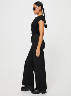 side view of model wearing Princess Polly Jeller Pinstripe Pants Black Petite High Rise Pants Pants 
