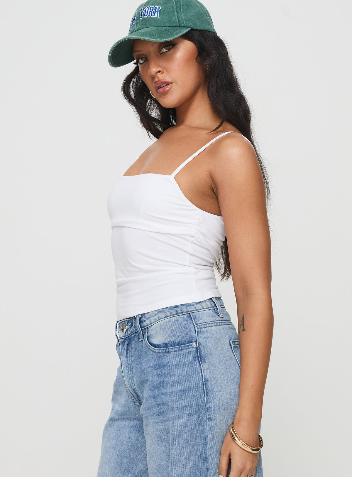 side view of model wearing Princess Polly Halbert Ruched Top White Sleeveless Square Neck 