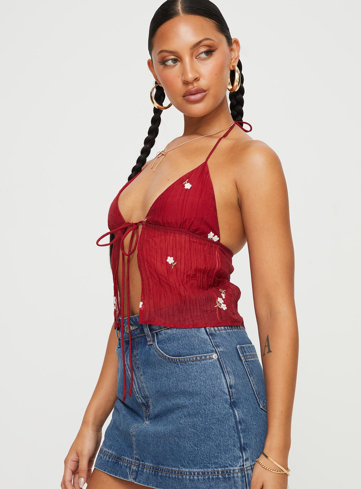 side view of model wearing Princess Polly Chantria Top Red Sleeveless Plunger 