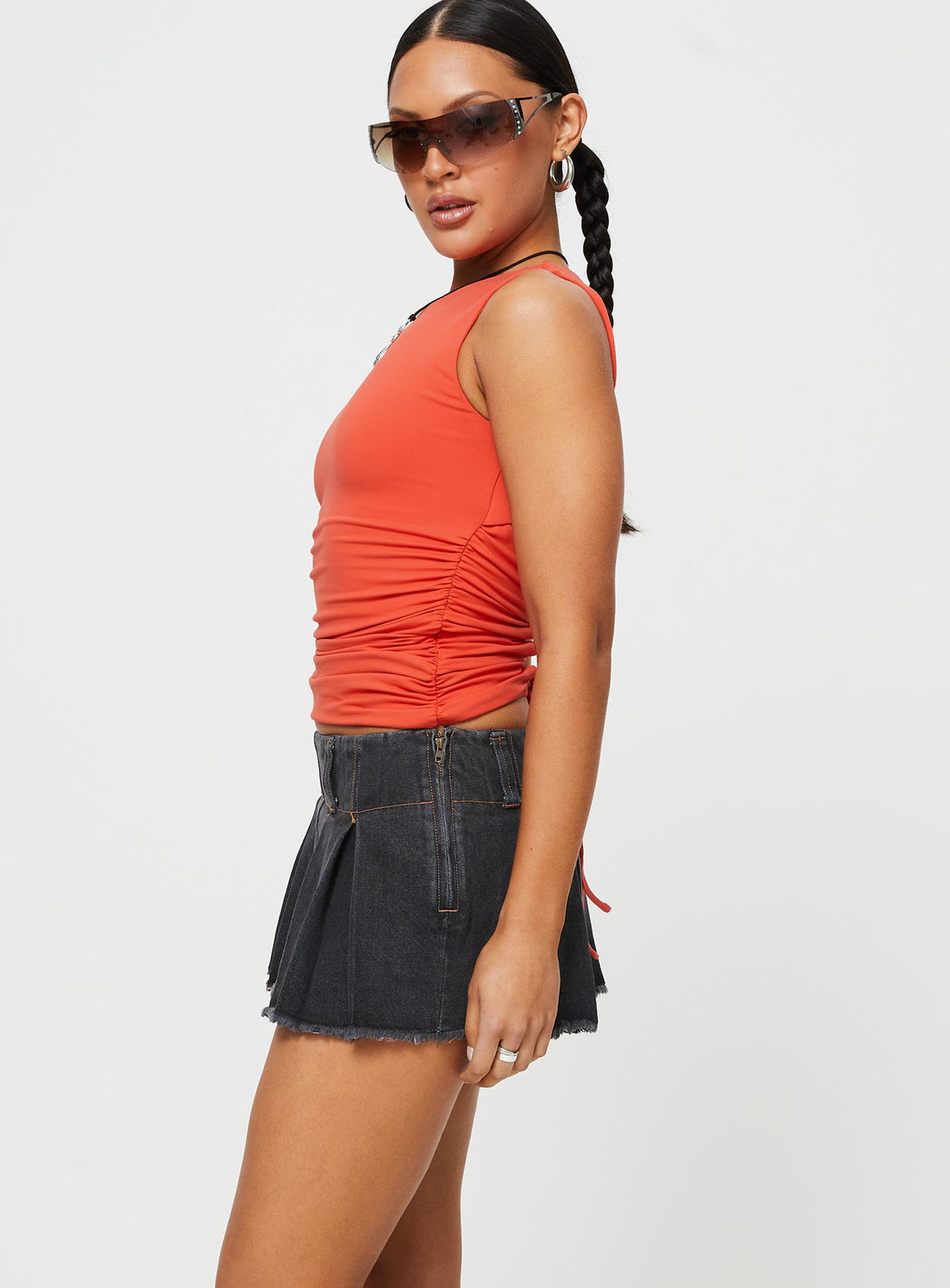 side view of model wearing Princess Polly Allure 90's Mini Skort Charcoal Low Rise Shorts 