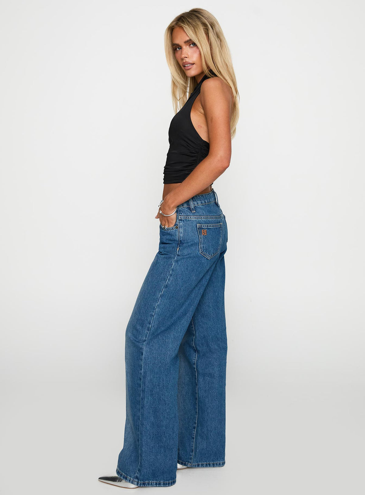 side view of model wearing Princess Polly On Sunset Mid Rise Straight Leg Jeans Dark Wash Mid Rise Jeans Jeans 