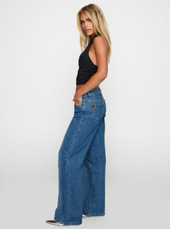 side view of model wearing Princess Polly On Sunset Mid Rise Straight Leg Jeans Dark Wash Mid Rise Jeans Jeans 