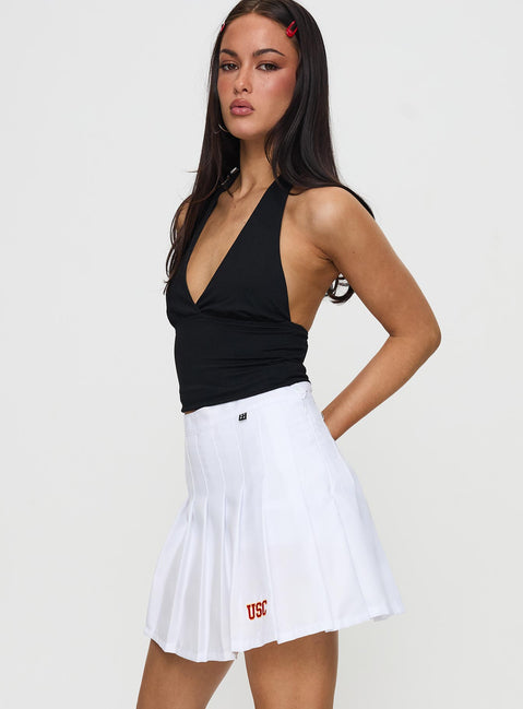   side view of model wearing Princess Polly USC Tennis Skort White Skirts 