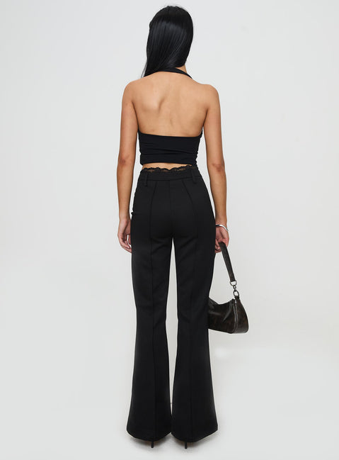 back view of model wearing Princess Polly Stellina Slim Fit Flared Pants Black High Waisted Pants 