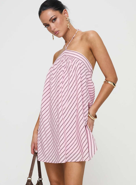 side view of model wearing Princess Polly Moonlit Mini Dress Pink Stripe Petite Asymmetric Neckline 