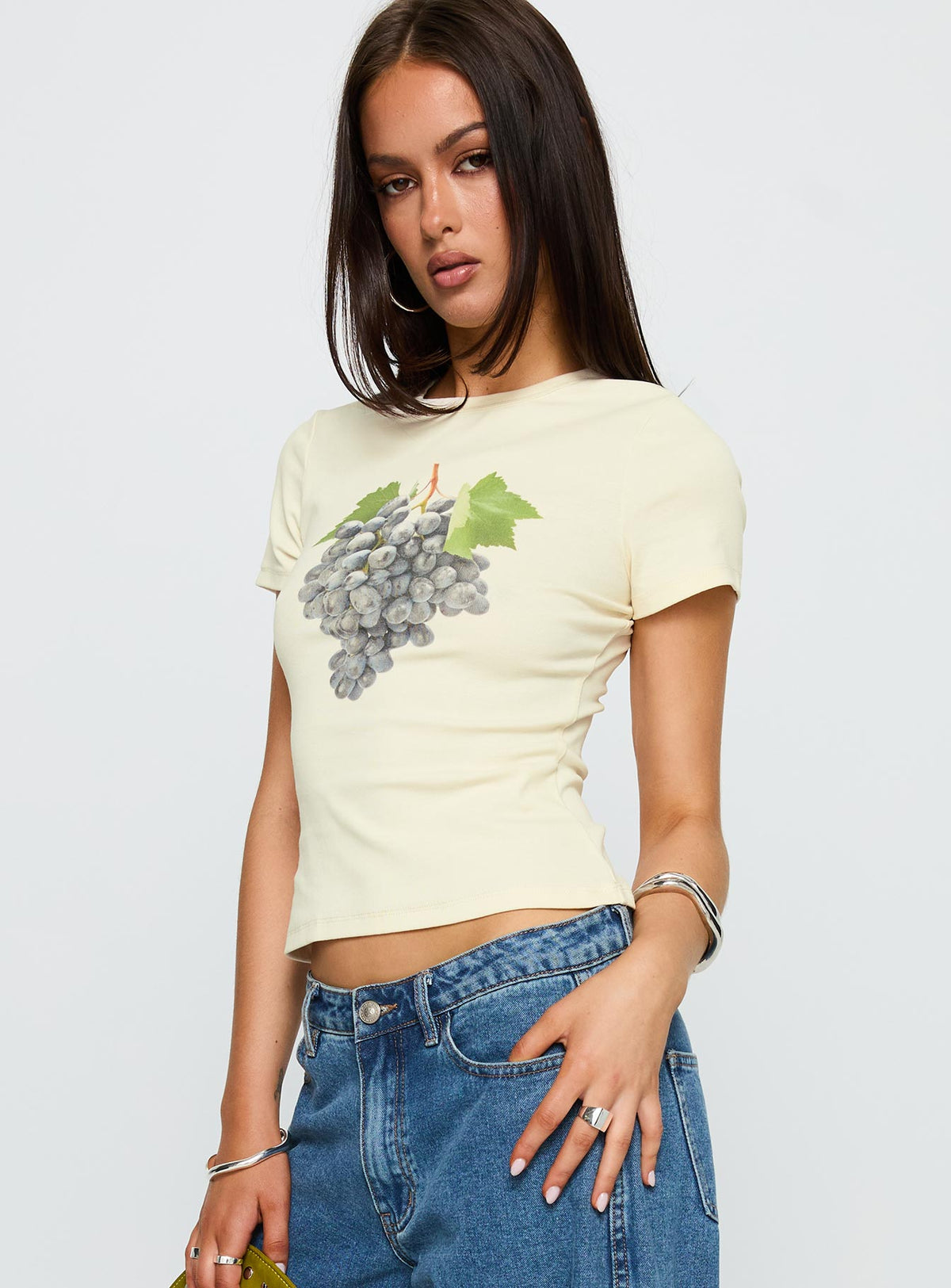 side view of model wearing Princess Polly Grapejuice Graphic Top Cream Short Sleeves Crew Neck 