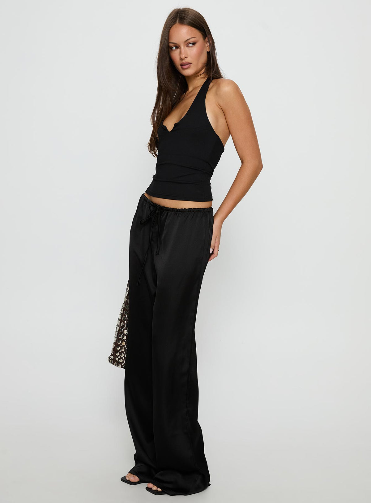 side view of model wearing Princess Polly Soulstar Satin Pants Black High Rise Pants Pants 