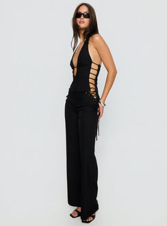 side view of model wearing Princess Polly Riane Lace Up Pants Black Mid Rise Pants Pants 