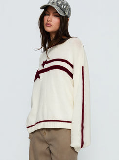 side view of model wearing Princess Polly Star Track Graphic Jumper Cream / Red Longline Jumpers Jumpers 