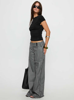 Crafted with style, the Cedars Low Rise Pant Grey Stripe Petite womens-regular-pants side view of model wearing Princess Polly