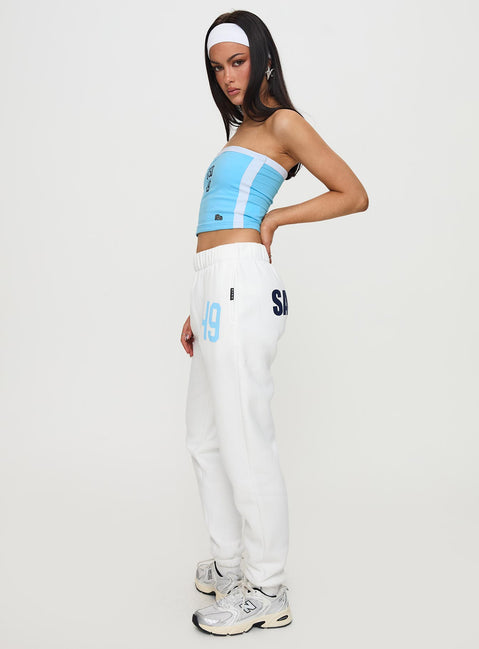 Featuring the USD Sweatpants White in womens-regular-pants with mid-rise waist, side view of model wearing Princess Polly