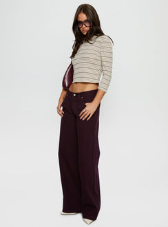 side view of model wearing Princess Polly Supercut Low Rise Baggy Pleat Jeans Currant Mid Rise Jeans Jeans 