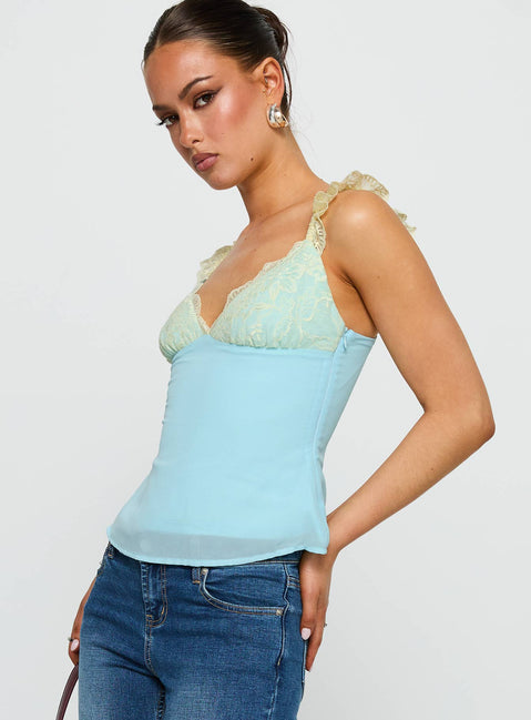 side view of model wearing Princess Polly Delvonte Top Blue / Yellow Sleeveless V-Neck 