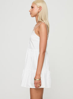 side view of model wearing Princess Polly Zorion Mini Dress White V-Neck 