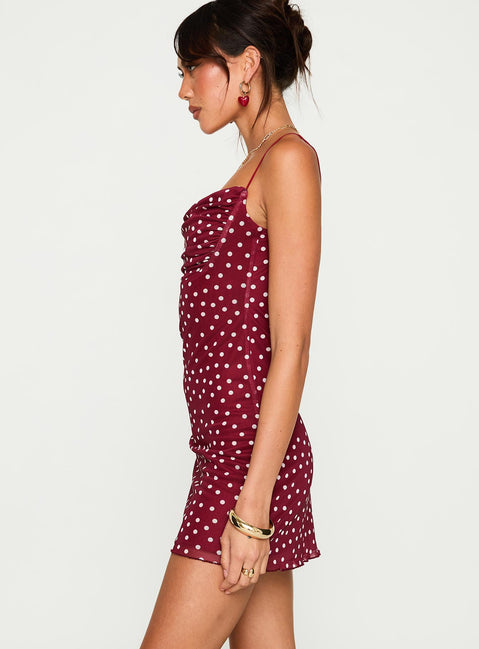 side view of model wearing Princess Polly Sugar Mini Dress Red Polka Cowl Neck 