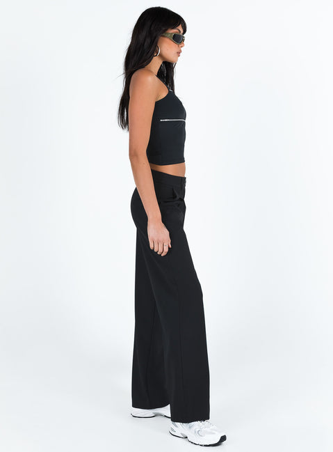 side view of model wearing Princess Polly Archie Low Rise Pants Black Petite Mid Rise Pants Pants 