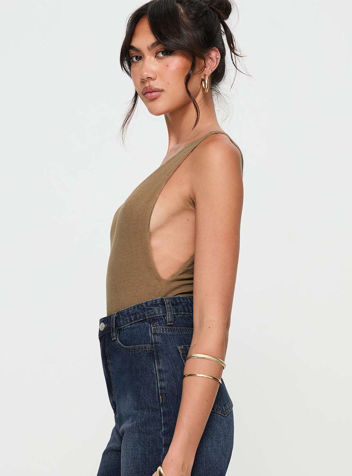 side view of model wearing Princess Polly Yolando Bodysuit Taupe Sleeveless Bodysuit 