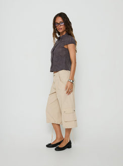 Showcasing the Relaxer 3/4 Cargo Pants Beige in womens regular pants with mid-rise side view of model wearing Princess Polly