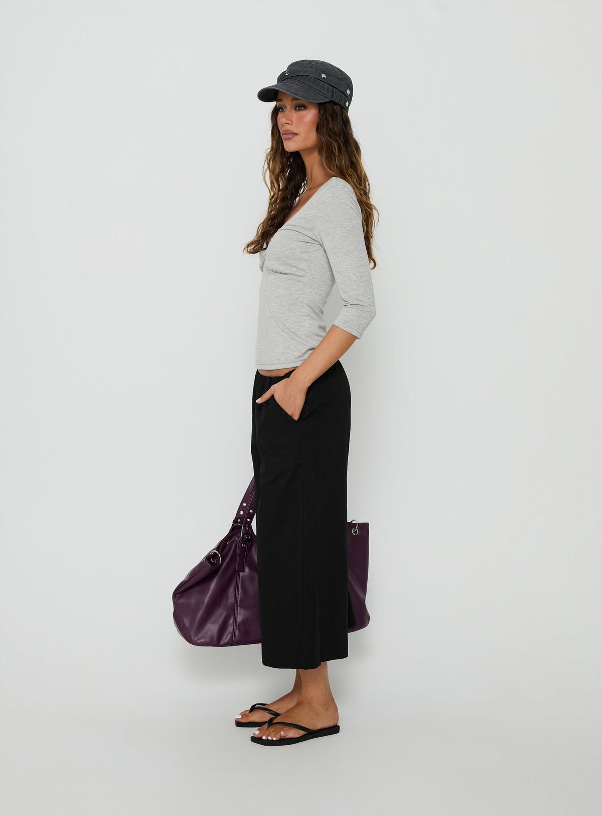 Featuring the Lunea Concealed Waistband 3/4 Pant Black Tall womens-regular-pants with mid-rise side view of model wearing Princess Polly