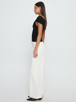 side view of model wearing Princess Polly Catiana Low Rise Wide Leg Jeans White Low Rise Jeans Jeans 