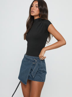   side view of model wearing Princess Polly Elinora Wrap Mini Skirt Mid Blue Wash Mini Skirts Skirts 