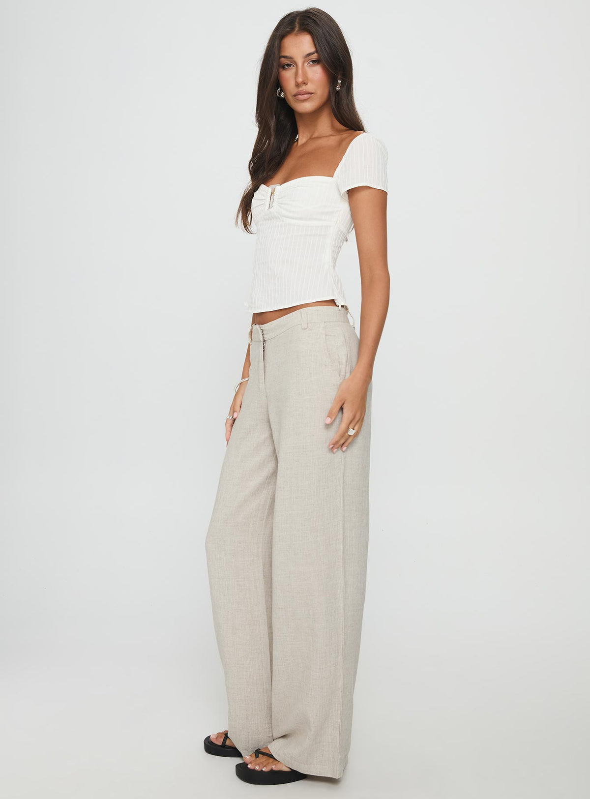 side view of model wearing Princess Polly Syrena Tailored Wide Leg Pant Natural Mid Rise Pants Pants 