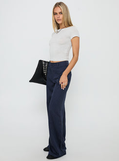 side view of model wearing Princess Polly Lorenne Mid Rise Pant Navy Pinstripe High Rise Pants Pants 