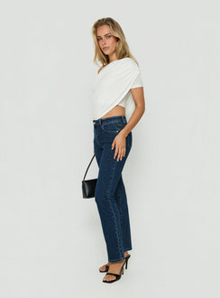 Designed with Harpor Mid Rise Slim Skinny Jean Mid Blue Wash womens-jeans featuring belt side view of model wearing Princess Polly