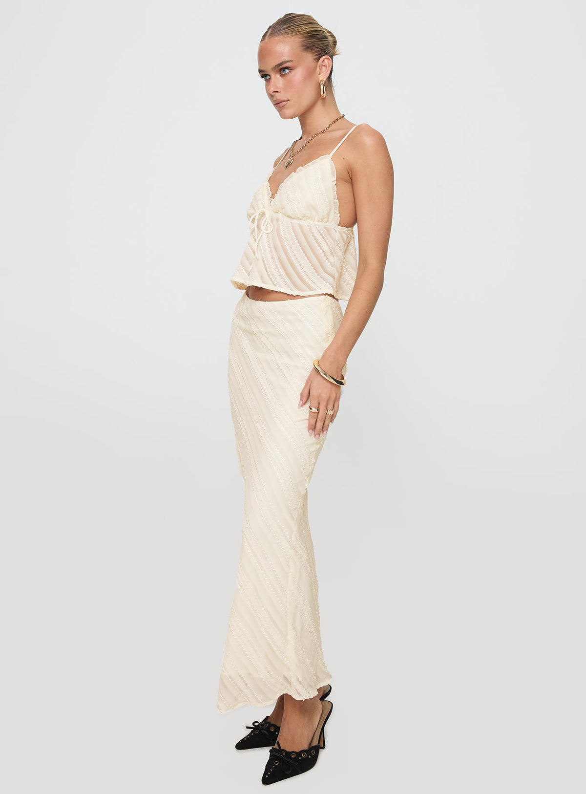   side view of model wearing Princess Polly Jacintha Maxi Skirt Cream Maxi Skirts Skirts 