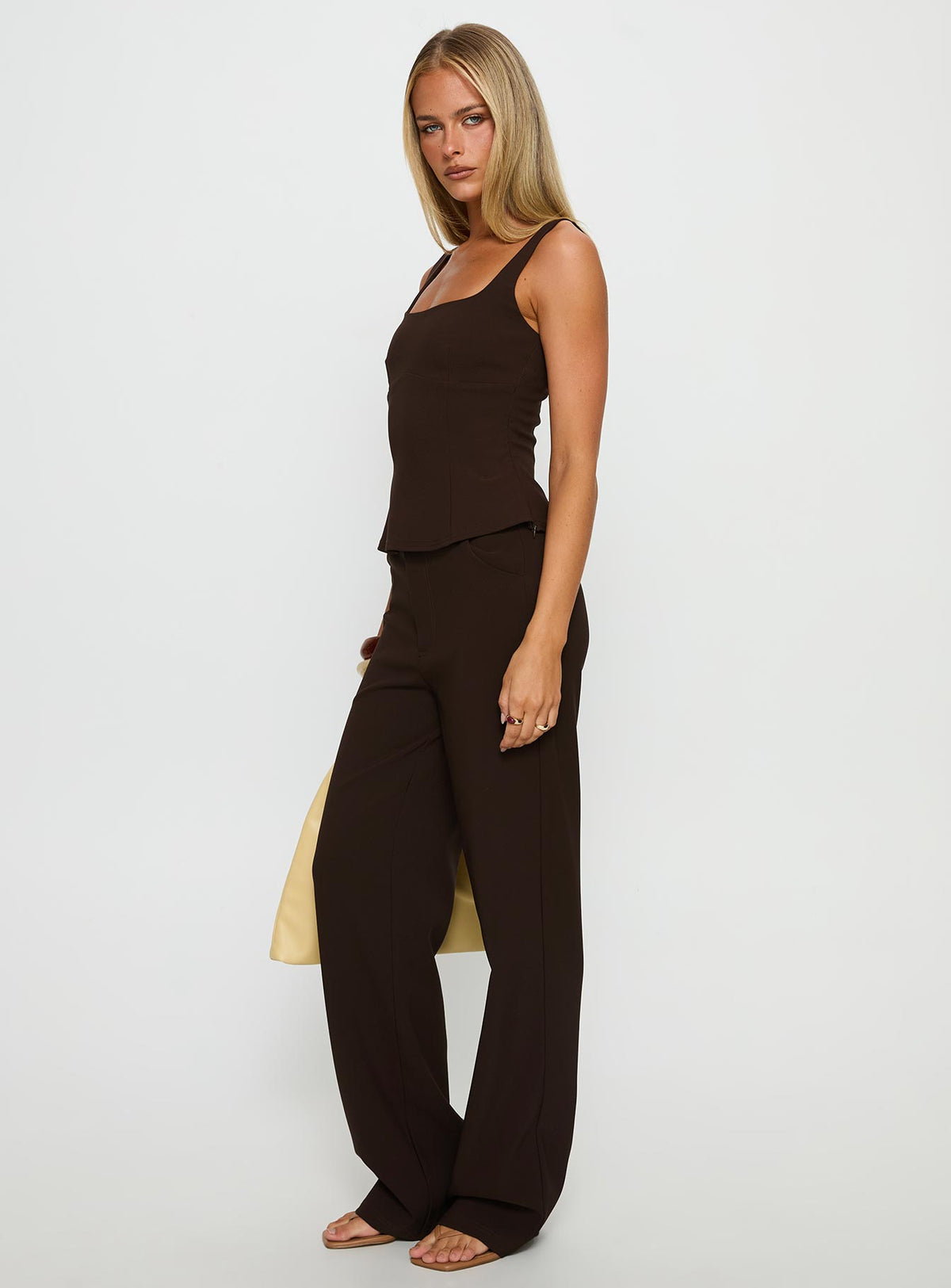 side view of model wearing Princess Polly Kinsie Tailored Pants Brown High Rise Pants Pants 