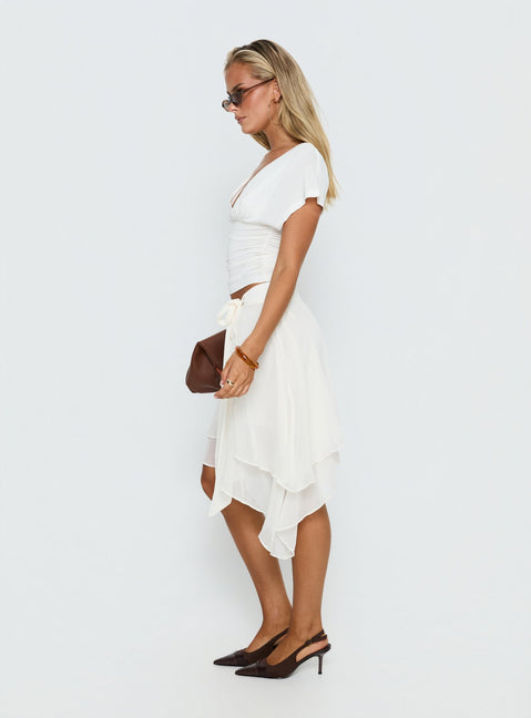 Styled with the Ophella Tie Waist Chiffon Midi Skirt Cream womens-skirts in midi length side view of model wearing Princess Polly