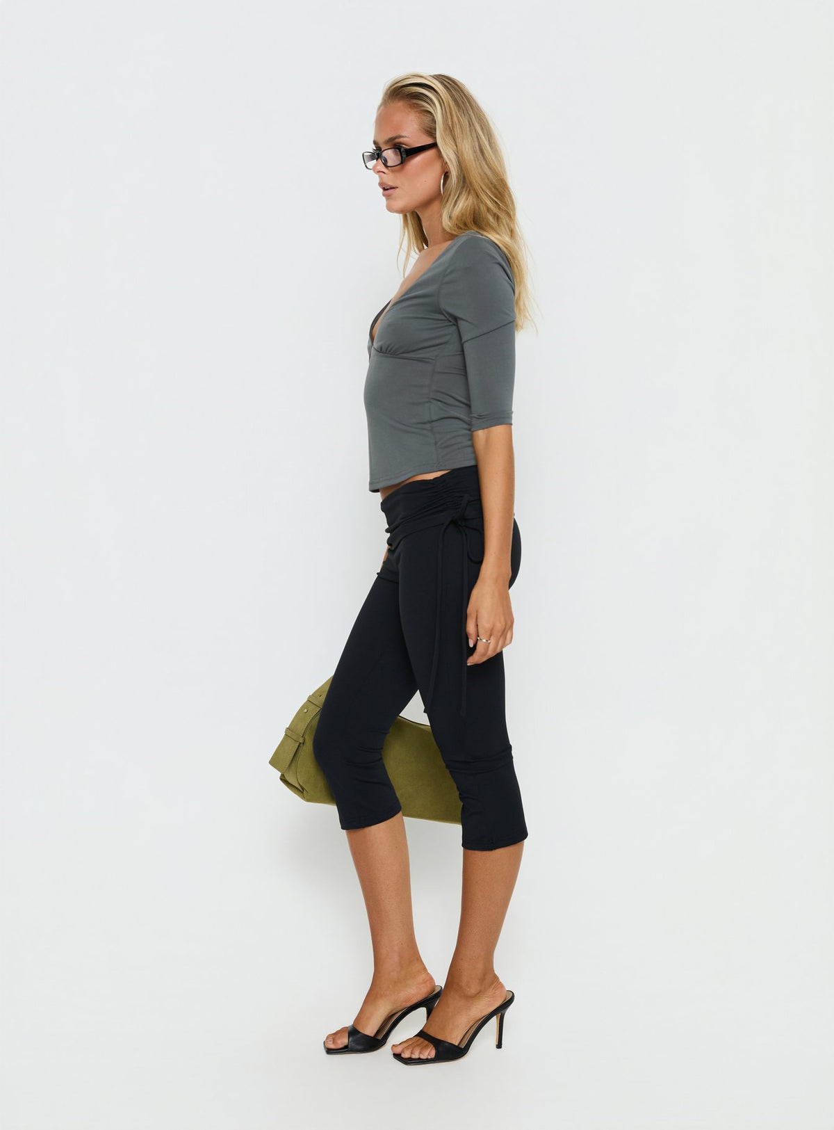 Crafted from the Bailor Channel Waistband Capri Pants Black in womens-regular-pants with high-rise ruched details side view of model wearing Princess Polly