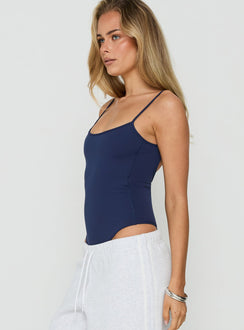 Styled in sleeveless silhouette, the Daily Define Thin Strap Low Back Bodysuit Navy womens-bodysuit side view of model wearing Princess Polly