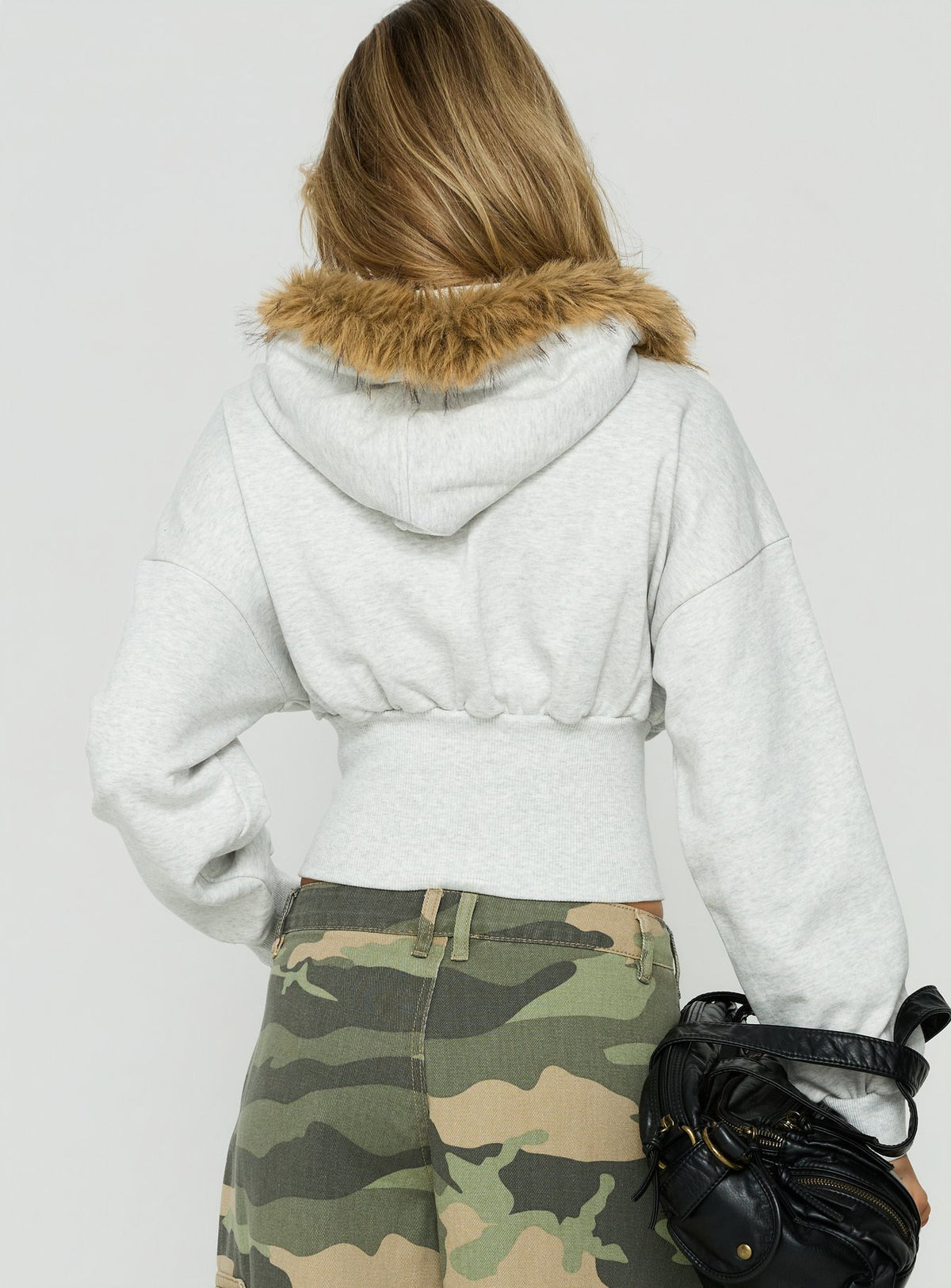Showcasing the Ramonda Faux Fur Hooded Jumper in Grey Marle, a short oversized womens jumper, back view of model wearing Princess Polly