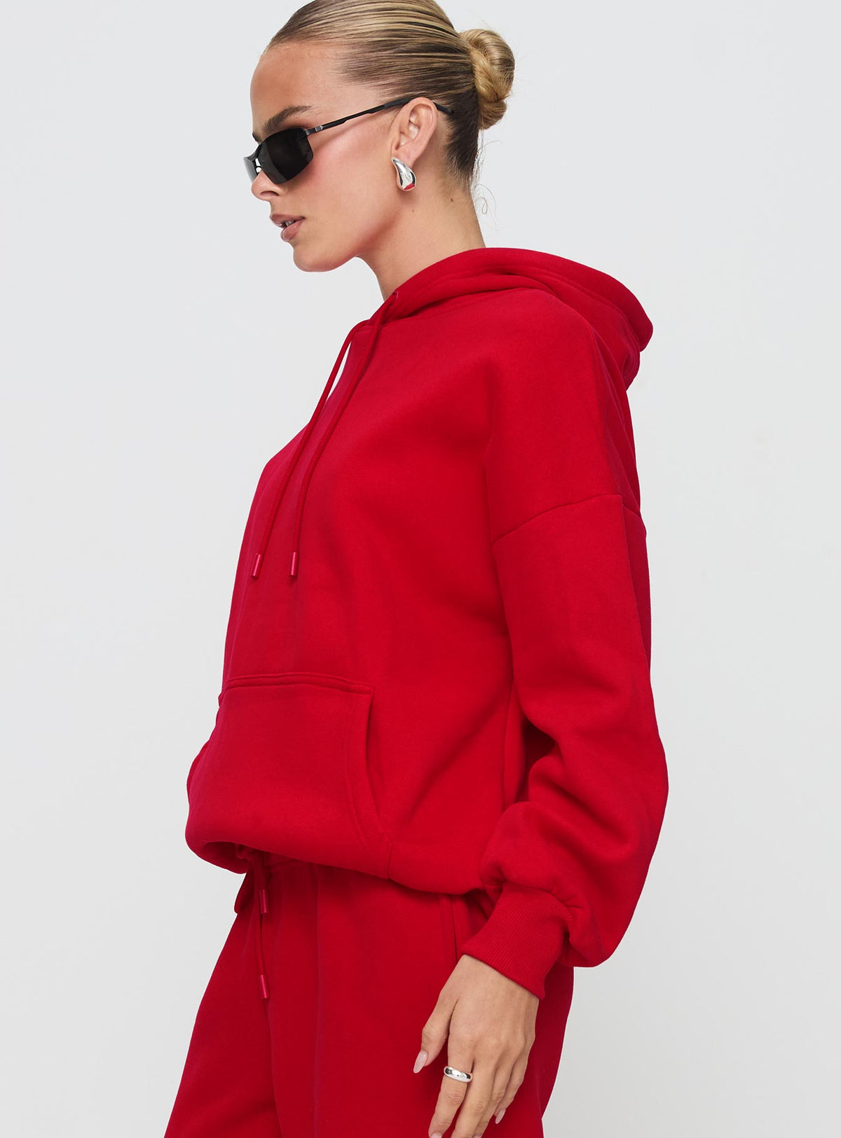 side view of model wearing Princess Polly Dream Fleece Classic Hoodie Red Longline Jumpers Jumpers 